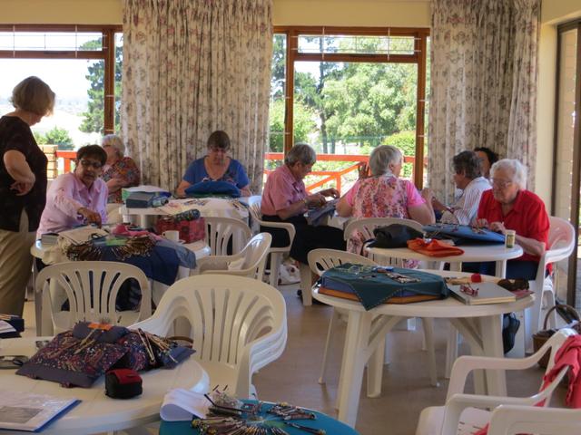 Some of our members enjoying a lovely day, making lace at the Durbanville Rose Garden.